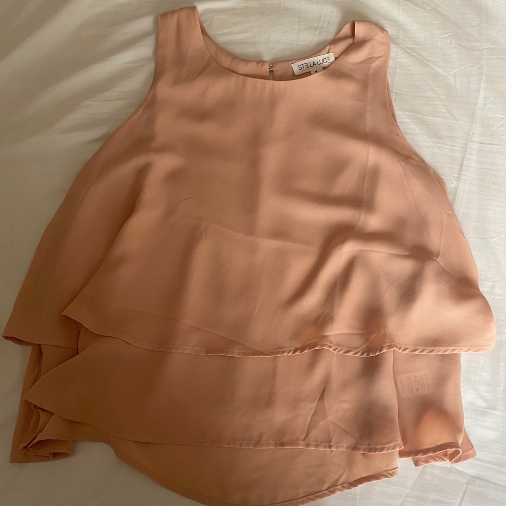 Sleeveless, ruffled blouse